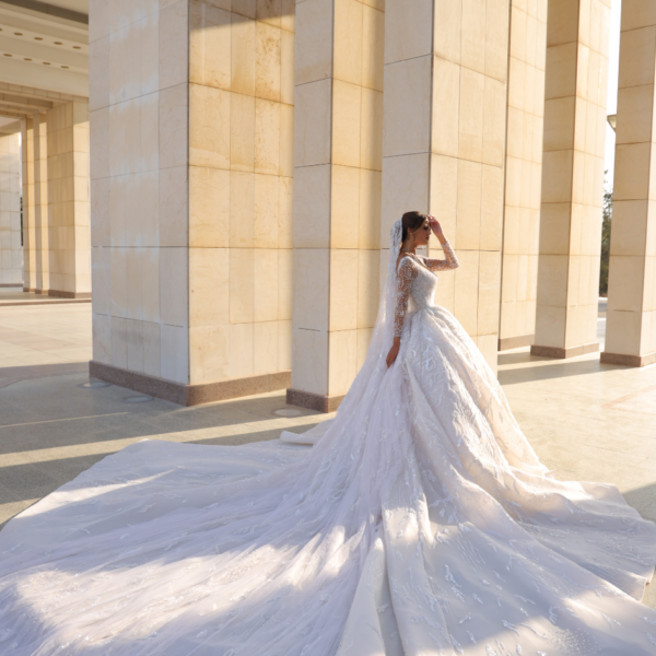 Off-white, long-trail, broad-pleated couture wedding dress